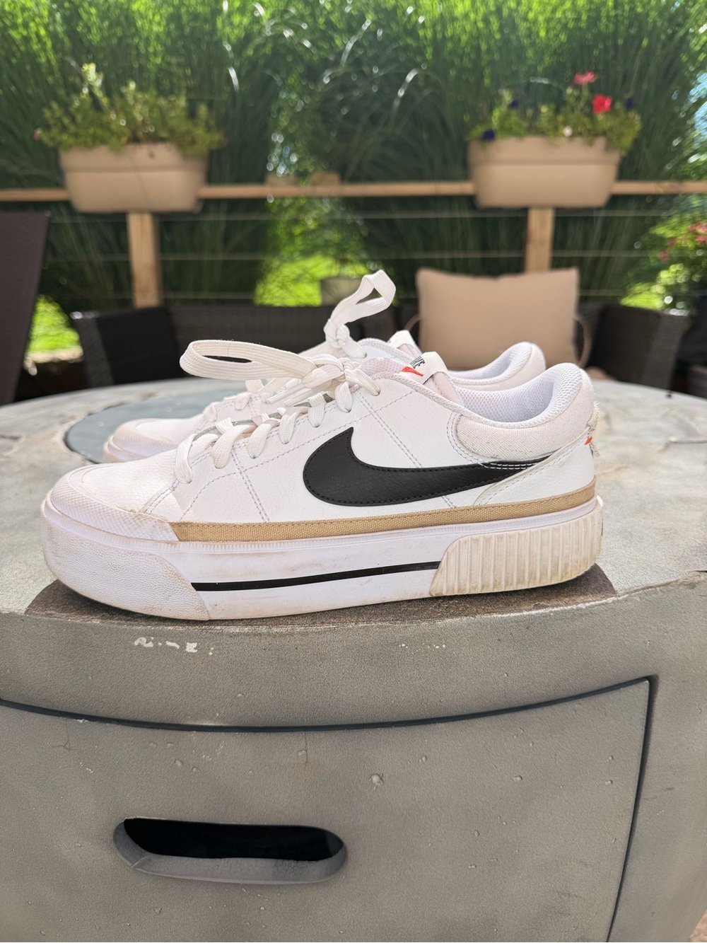 Nike Women's White Sneakers with Black Swoosh and Tan Accent